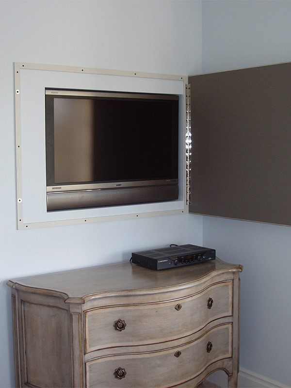 tv with hidden frame over dresser
