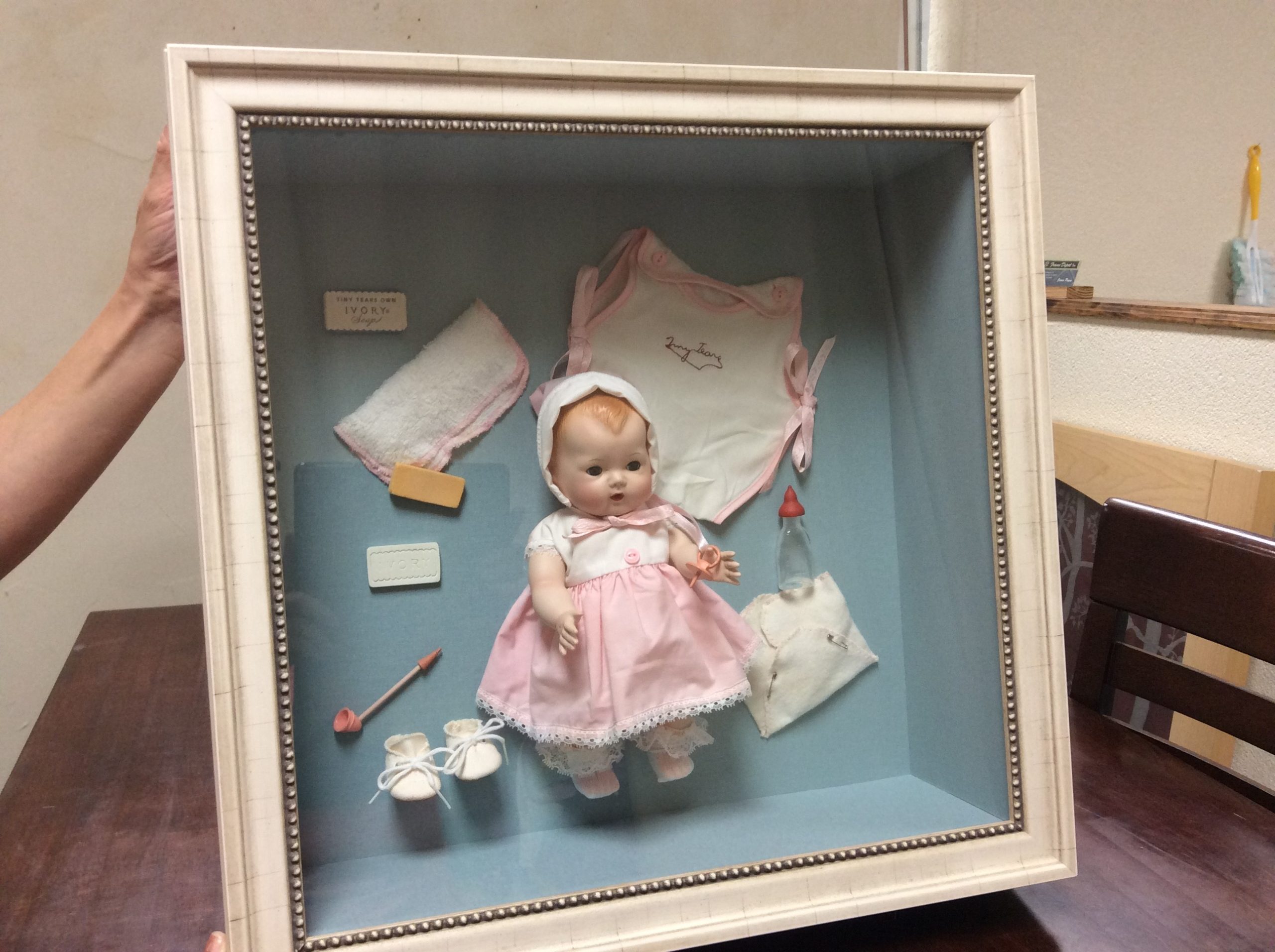 Baby doll preserved in frame for Mother's Day