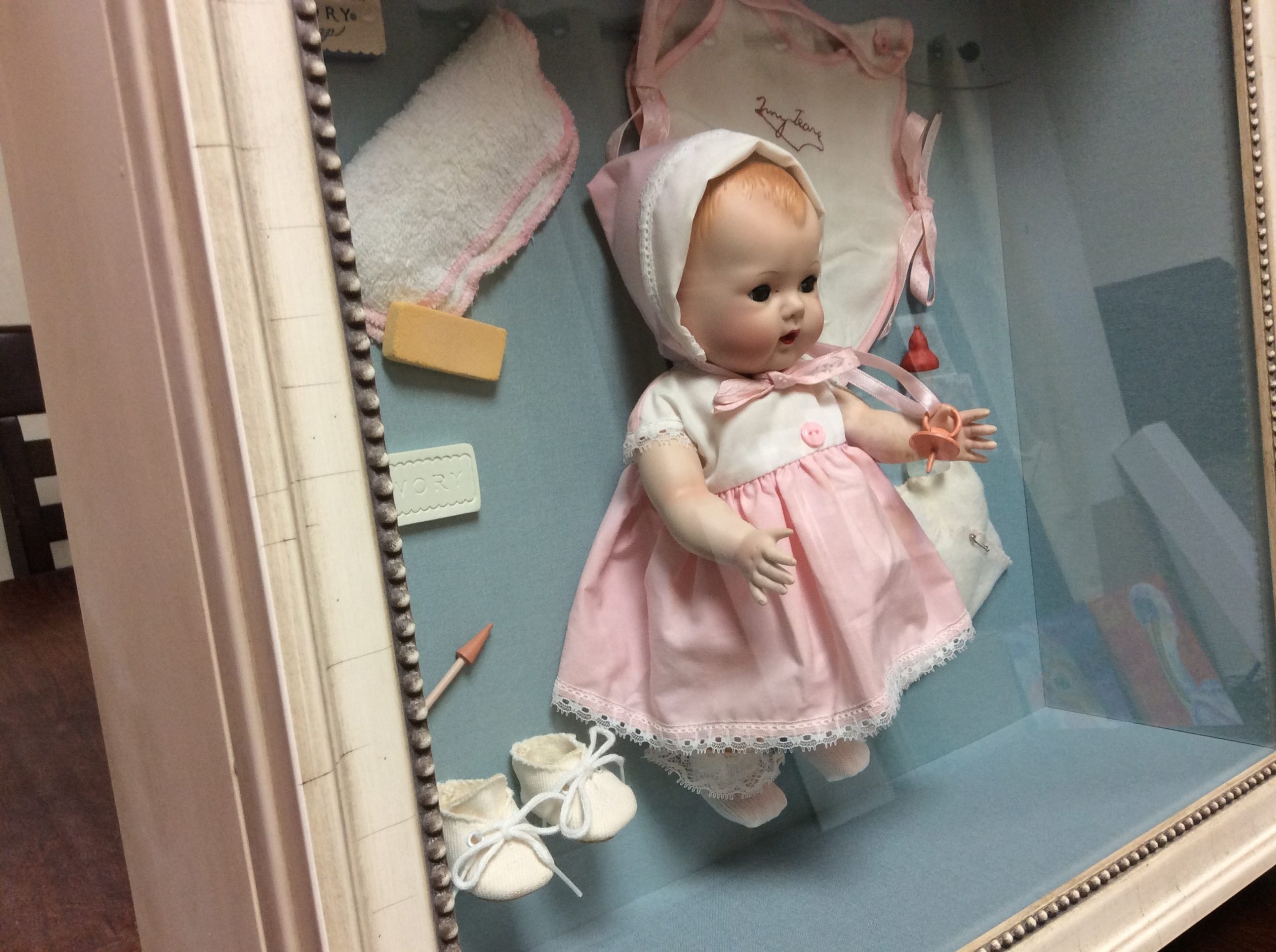Baby doll preserved in frame for Mother's Day