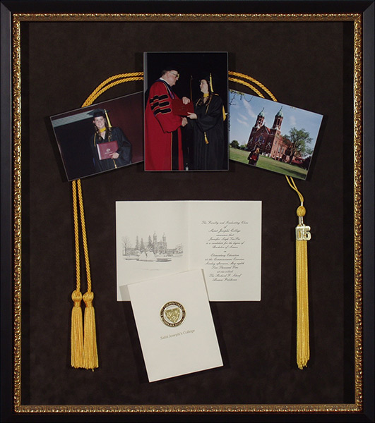 gold frames around graduation memorabilia
