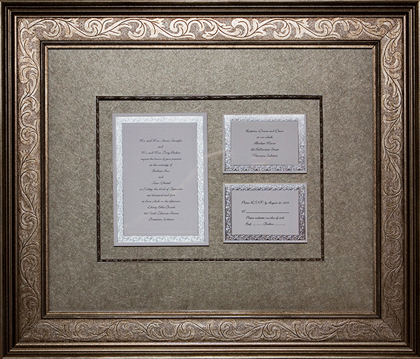 gold mats with framed invites